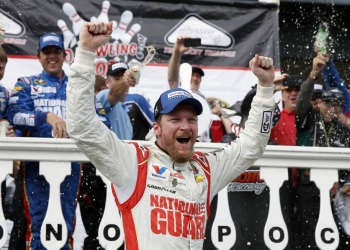FILE - In this Aug. 3, 2014, file photo, Dale Earnhardt Jr. celebrates in Victory Lane after winning a NASCAR Sprint Cup Series auto race at Pocono Raceway in Long Pond, Pa. Longtime fan favorite Dale Earnhardt Jr. is expected to be the marquee name on NASCAR's 2021 Hall of Fame class, to be announced Tuesday, June 16, 2020. (AP Photo/Matt Slocum, File)