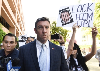 FILE - In this July 1, 2019, file photo, U.S. Rep. Duncan Hunter, R-Calif., leaves federal court after a hearing in San Diego. Hunter, who is facing corruption charges, wants his Sept. 10 trial postponed while his attorneys appeal a judge's refusal a month earlier to dismiss the case. (AP Photo/Denis Poroy, File)