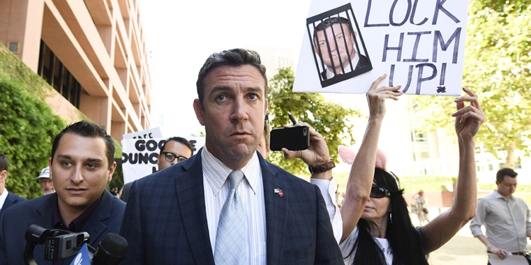 FILE - In this July 1, 2019, file photo, U.S. Rep. Duncan Hunter, R-Calif., leaves federal court after a hearing in San Diego. Hunter, who is facing corruption charges, wants his Sept. 10 trial postponed while his attorneys appeal a judge's refusal a month earlier to dismiss the case. (AP Photo/Denis Poroy, File)